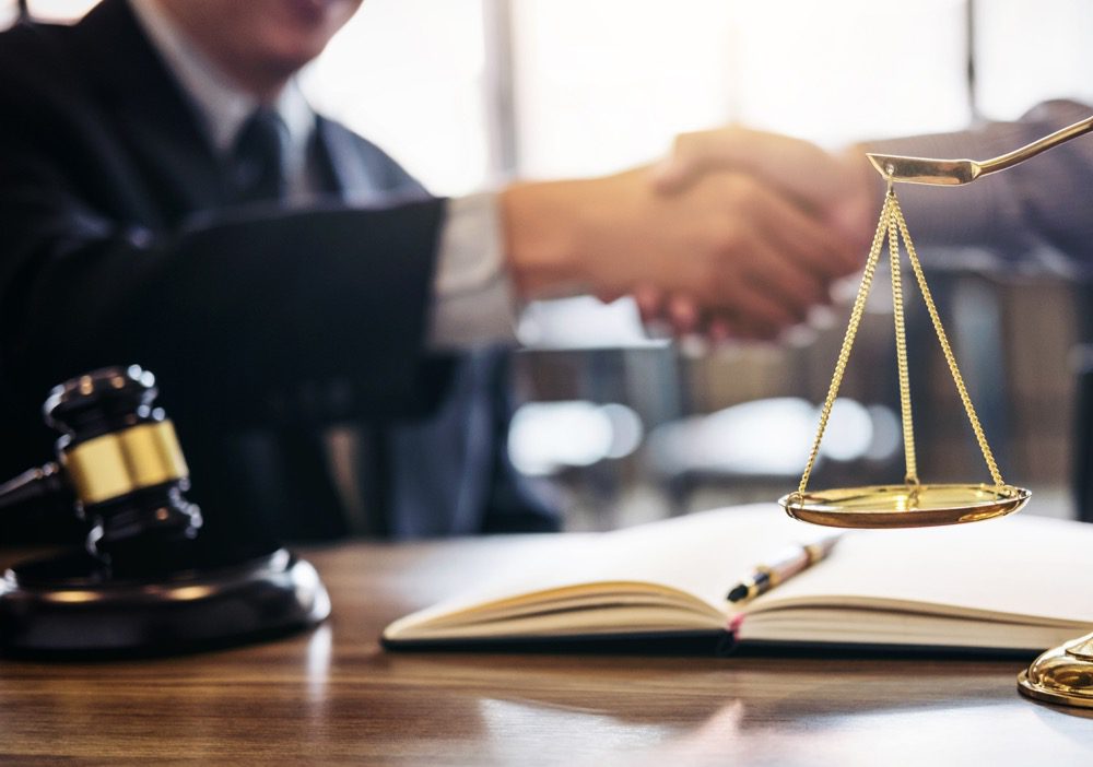 Handshake after drug crime win between lawyer and client