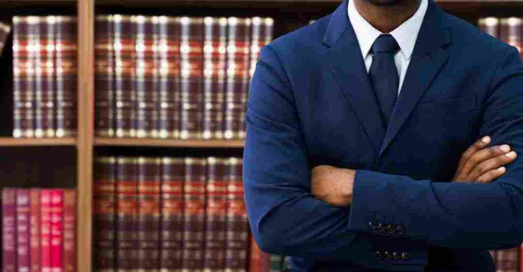 A lawyer with his arms crossed