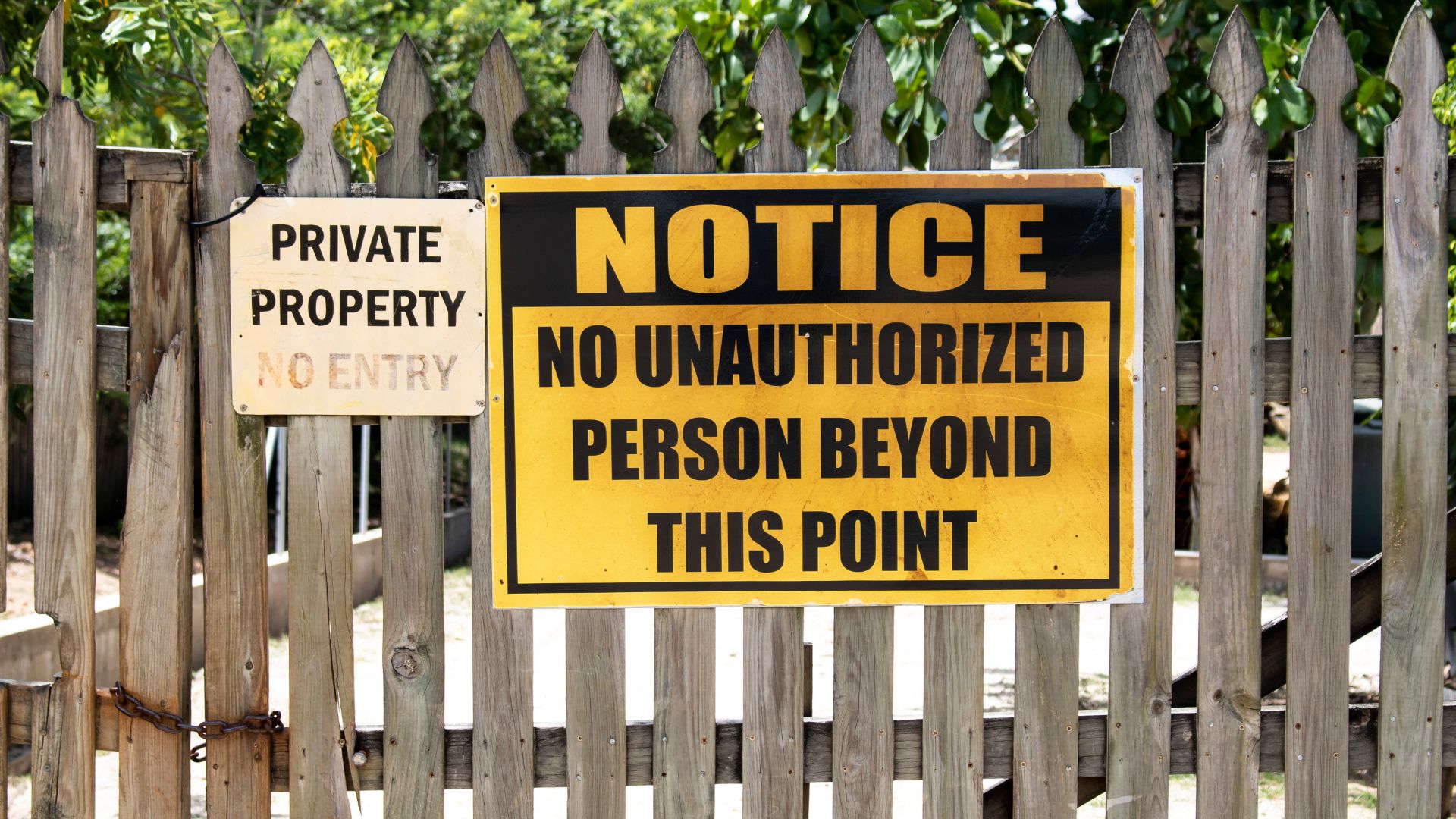 bright yellow no trespassing sign