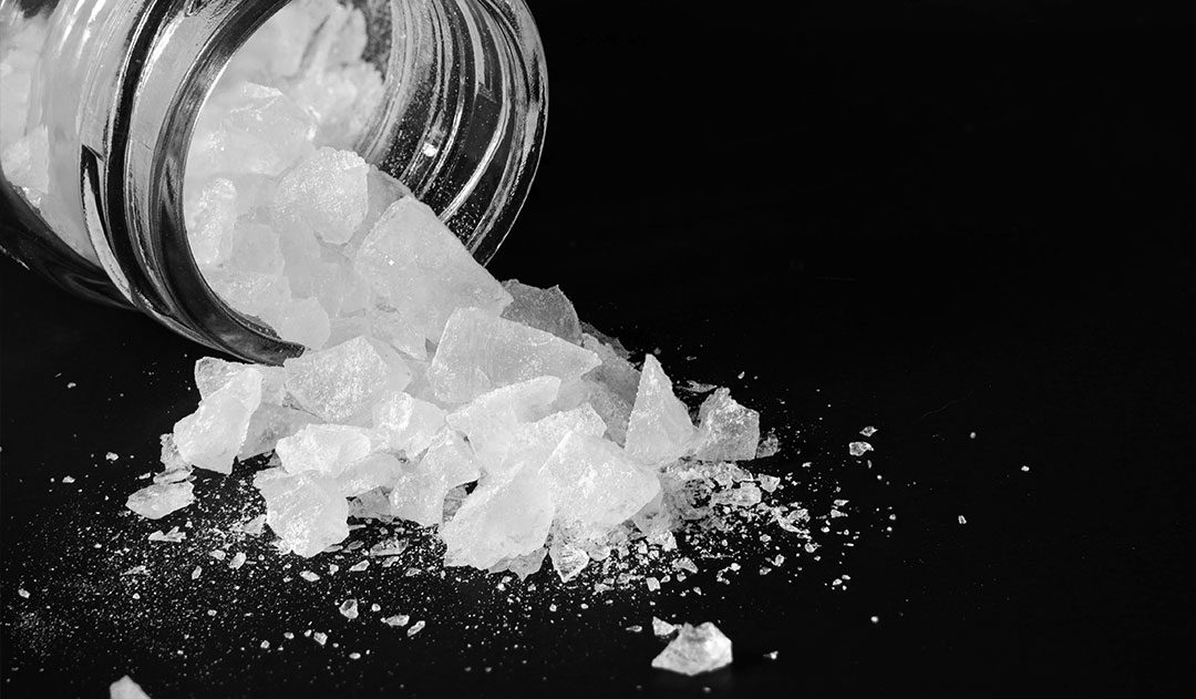 bottle of methamphetamine close up of bottle of Methamphetamine tipped over and spilling onto table