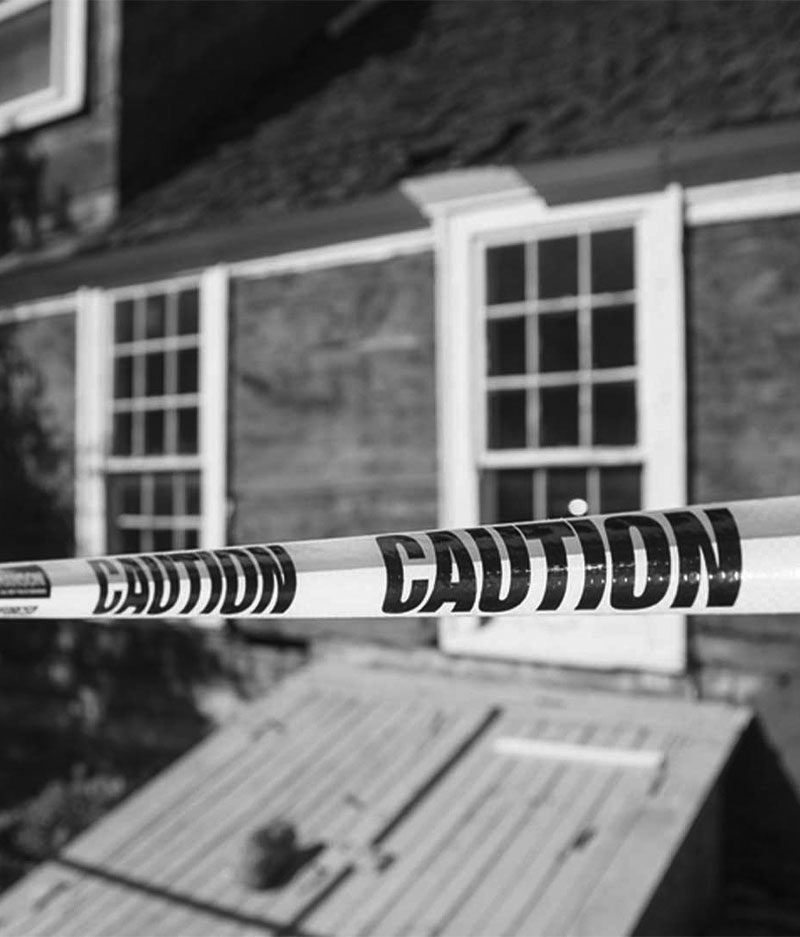 caution tape in font of home caution tape in front of home after michigan property crime arrest