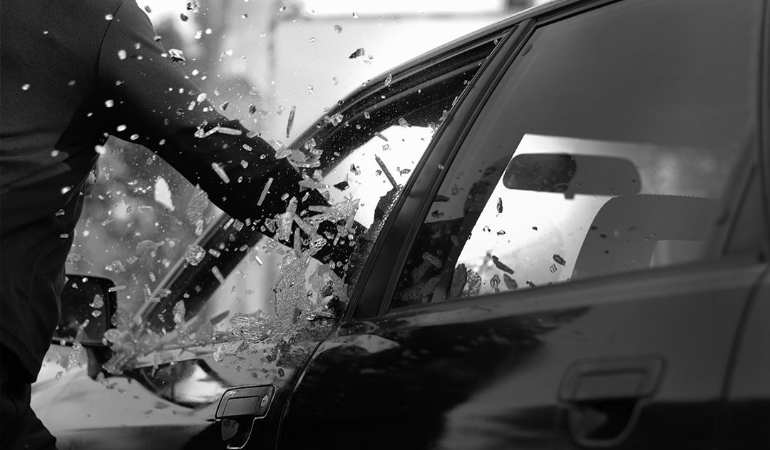 Malicious Destruction of Property Defense man punching through car window committing malicious destruction of property